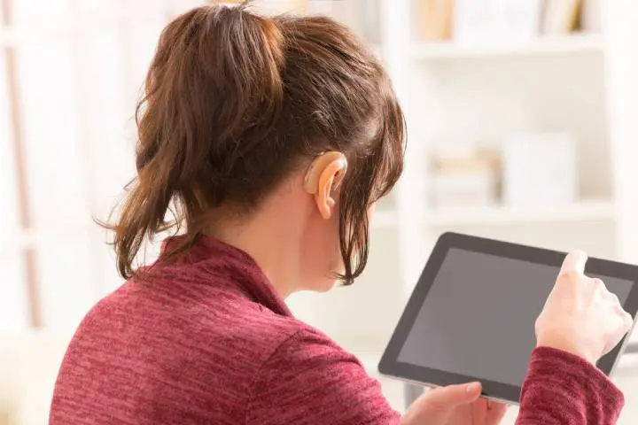 Deaf woman using tablet